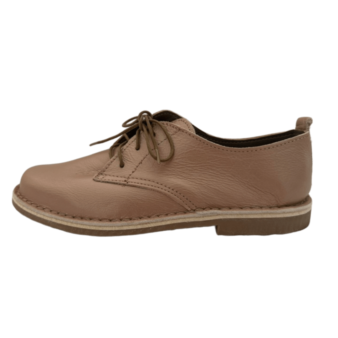 rose gold leather shoes with laces on a white background from the side