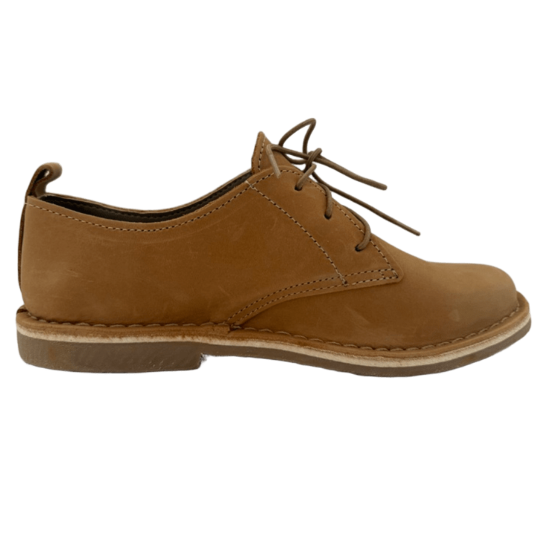 tan leather shoe on a white background from the side