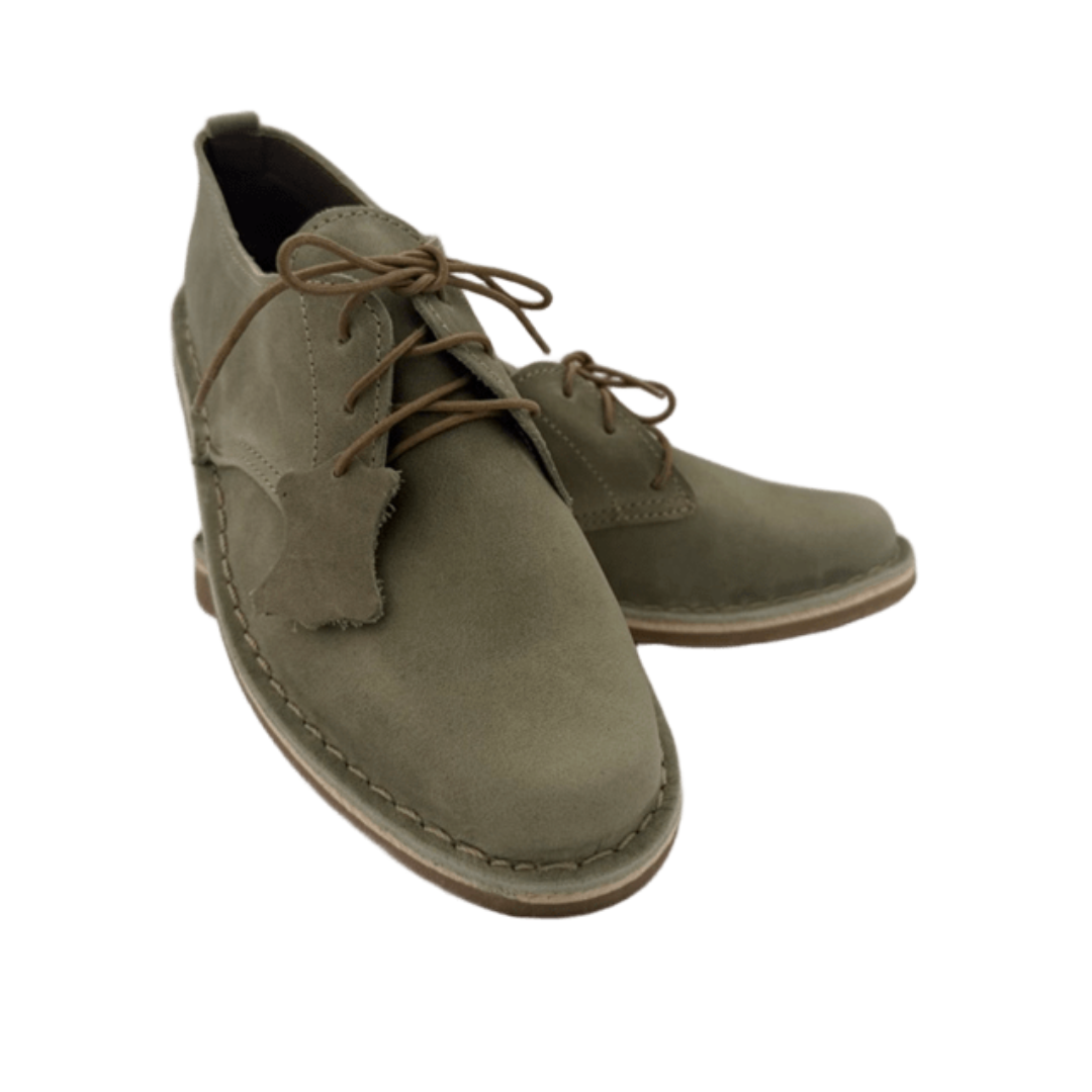 Pair of sage green shoes with brown laces on a white background from the front