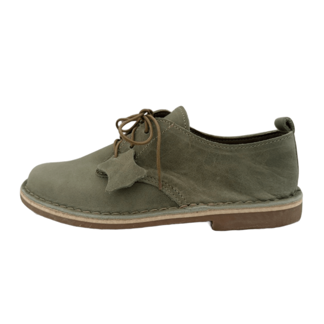 sage green shoes with brown laces on a white background from the side